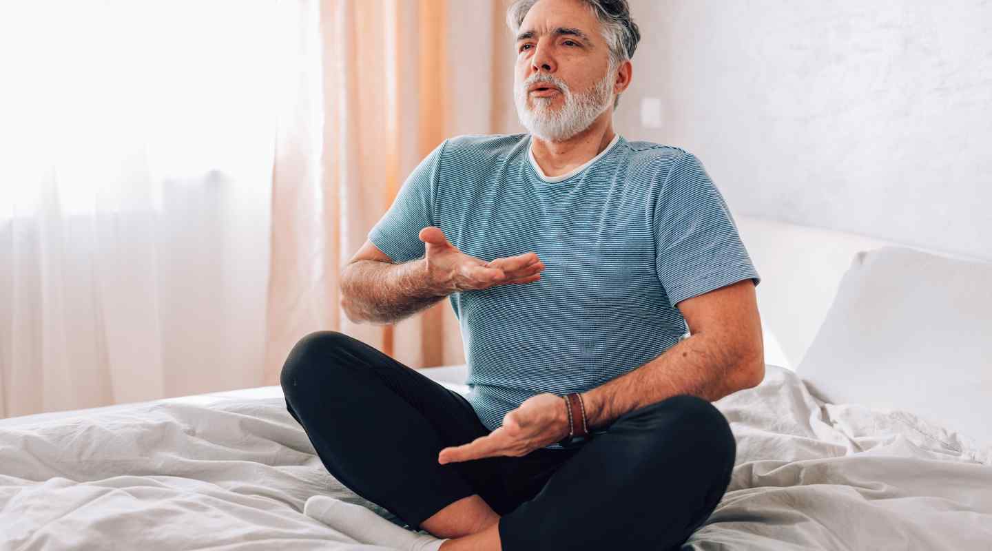 Man Meditating at Home