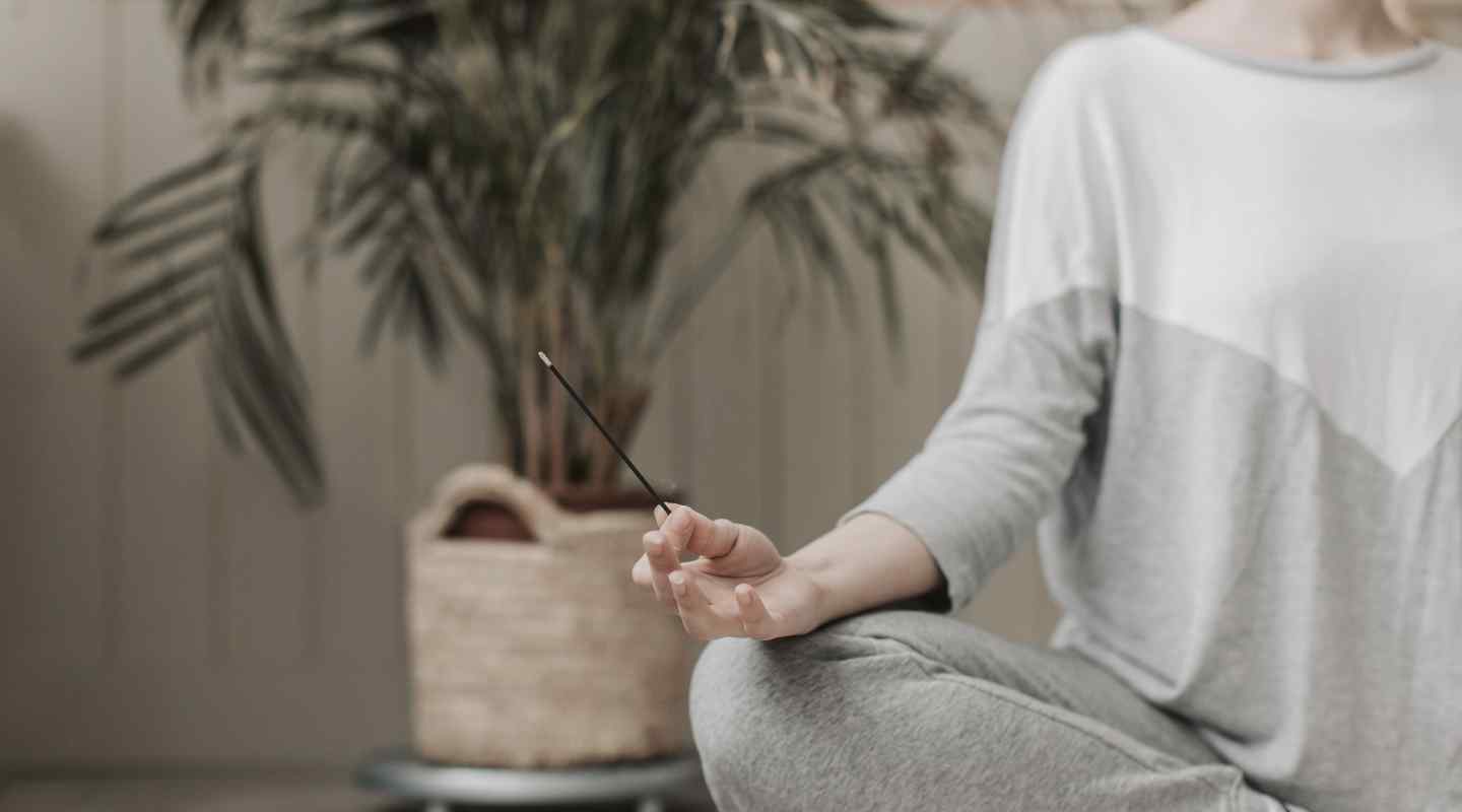 Woman Meditating with Incense